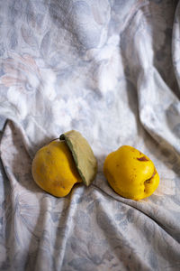 High angle view of yellow eggs on table