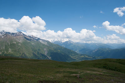 Scenic view of landscape and mountains against sky