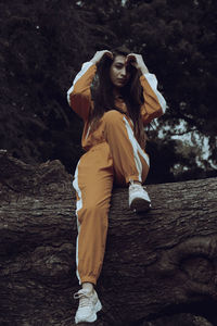 Side view of young woman standing on land