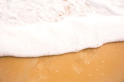 High angle view of surf on beach