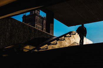 LOW ANGLE VIEW OF SILHOUETTE HOUSE AGAINST SKY