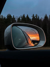 Reflection of car on side-view mirror