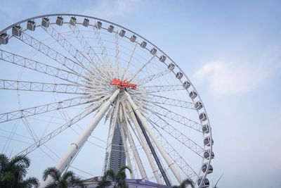 Low angle view of ferris wheel against sky