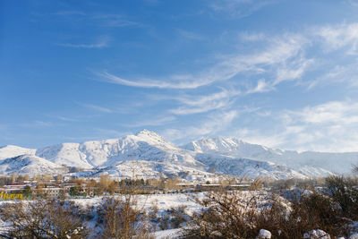 Snowy winter landscape on the tien shan mountains. blue sky in the mountains of uzbekistan