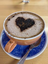 Close-up of coffee cup on table