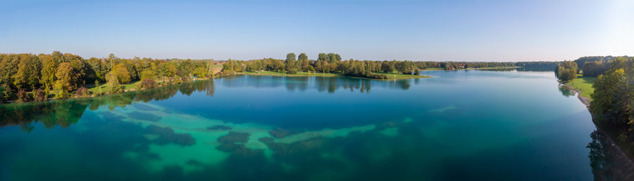 Scenic view of lake against blue sky