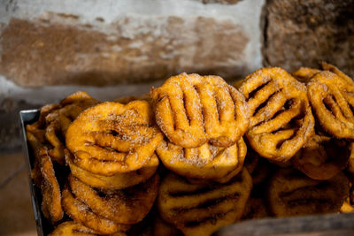 The preparation of a traditional food, sweet fritter called filhós from portugal. christmas time. 