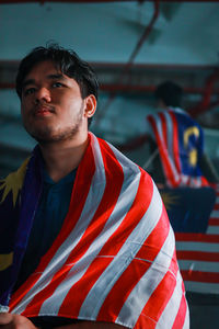 Portrait of young man standing outdoors