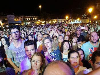 Group of people on street at night