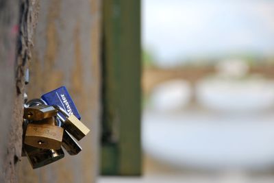 Close-up of padlocks on railing