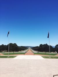 Scenic view of road against clear blue sky