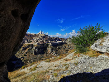 Low angle view of rock formation against sky