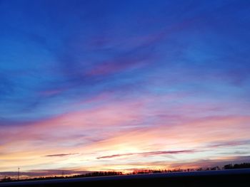 Scenic view of dramatic sky during sunset