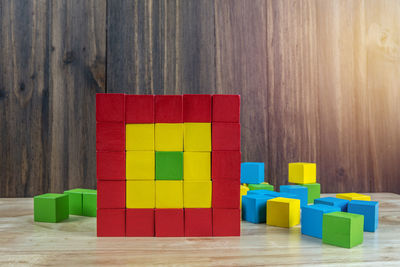 Stack of multi colored toy on table