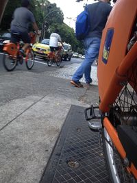 People riding motorcycle on road