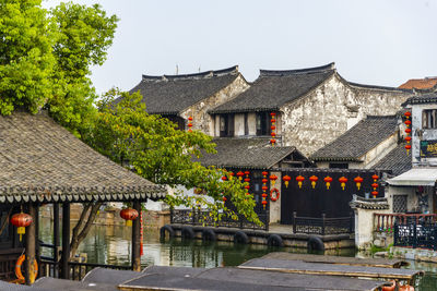 Houses in city against clear sky