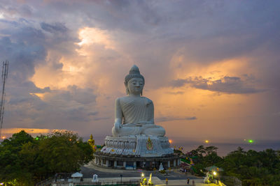 Statue of building against sky during sunset