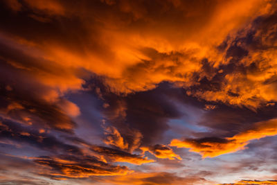 Low angle view of dramatic sky during sunset