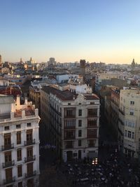 High angle view of buildings in city against clear sky