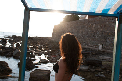 Rear view of woman looking at sea