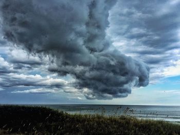 Scenic view of seascape against cloudy sky