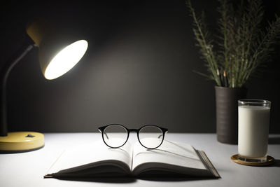 Close-up of electric lamp on table