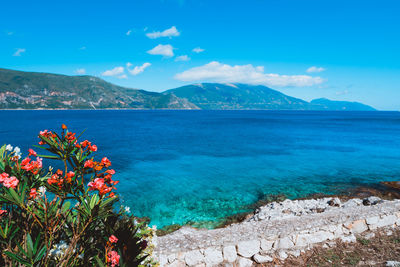 Scenic view of sea against blue sky