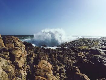 Scenic view of sea against clear blue sky