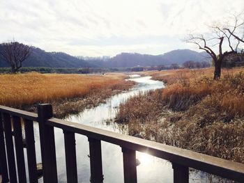 Scenic view of river and mountains