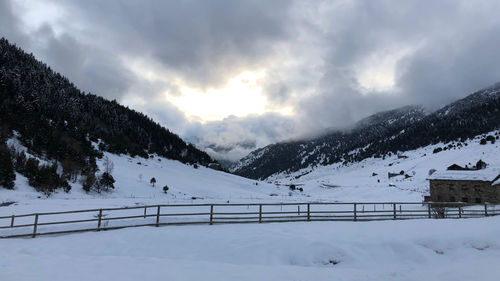 Scenic view of snow covered mountains against sky