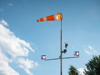 Low angle view of flag against sky