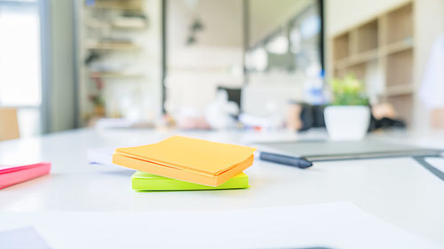 Close-up of yellow and book on table