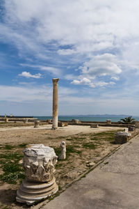 Old ruins at byrsa by mediterranean sea against cloudy sky