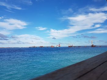 Scenic view of sea against blue sky