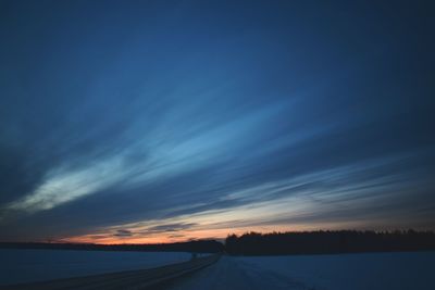 Road against sky at sunset