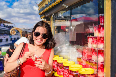 Portrait of woman wearing sunglasses at store