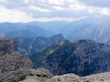 Scenic view of mountains against cloudy sky