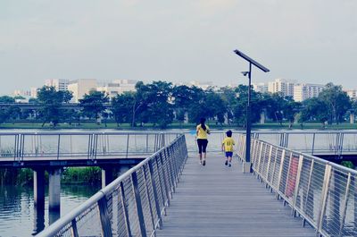 People walking on footbridge