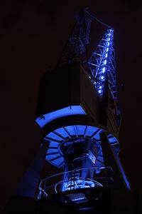 Low angle view of illuminated built structure at night