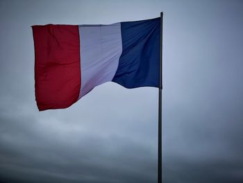 Low angle view of flag against sky