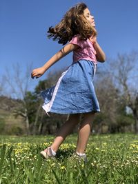 Full length of girl on field