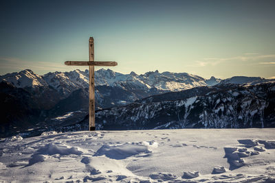 Scenic view of snow covered mountains against sky