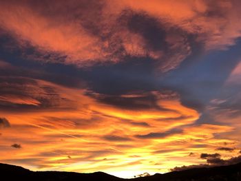 Low angle view of dramatic sky during sunset