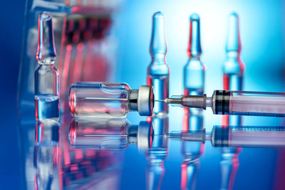 Close-up of glass bottles on table