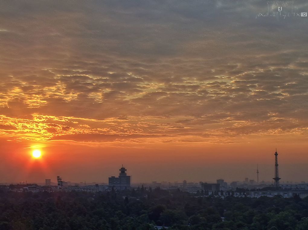 sunset, orange color, architecture, building exterior, sky, built structure, silhouette, sun, scenics, beauty in nature, cloud - sky, city, nature, idyllic, tranquil scene, tranquility, cityscape, sunlight, outdoors, dramatic sky