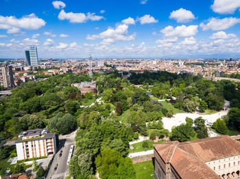 High angle view of buildings in city against sky