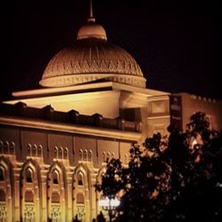 Low angle view of illuminated building at night