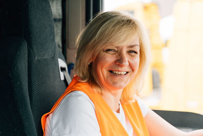 Portrait of happy driver in truck