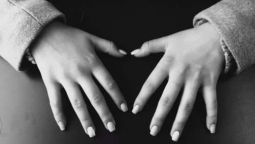 Midsection of man touching woman