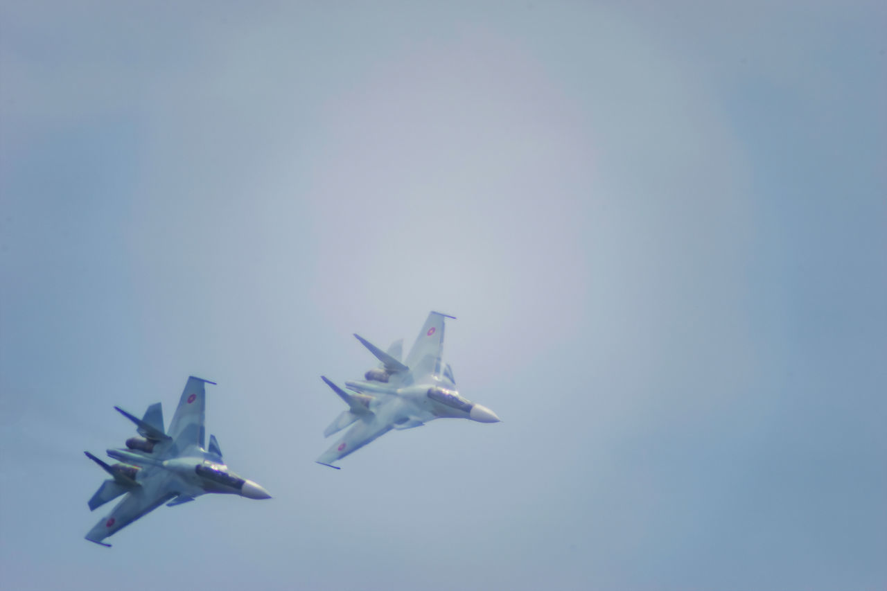 LOW ANGLE VIEW OF AIRPLANE IN SKY